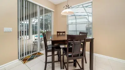 a dining room with a table and chairs at CW7740 Windsor Hills Resort Vacation Home in Orlando