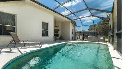 a swimming pool in a house with a glass ceiling at KP8038 Windsor Palms Resort Vacation Home in Kissimmee
