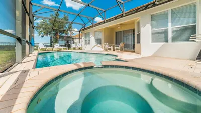 a swimming pool in the backyard of a house at Amazing 5 BR Home with Pool Windsor Hills Resorts in Orlando