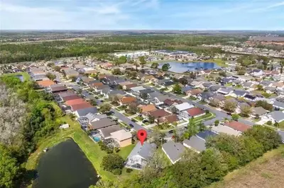 an aerial view of a suburb with a red marker at Disney area 4-bedrooms spacious villa for rent in Kissimmee