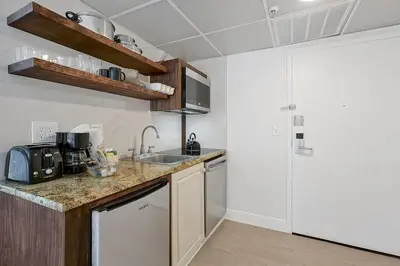 a kitchen with a sink and a counter top at 6165 CARRIER DR #1212 ORLANDO 1BED in Orlando