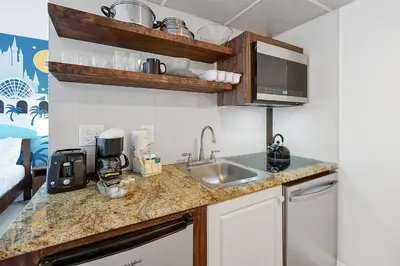 a kitchen with a sink and a counter top at 6165 CARRIER DR #1212 ORLANDO 1BED in Orlando