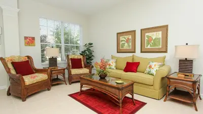a living room with a couch and chairs at 6-Bedroom 2505 in Orlando