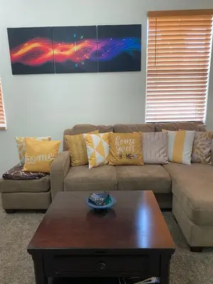 a living room with a couch and a coffee table at Home Near Disney Private Pool & Playground in Howey in the Hills