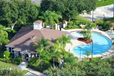 an overhead view of a house with a swimming pool at Villa Port - Lucaya Village in Kissimmee