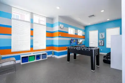 a room with blue and orange stripes on the walls at Magic Villa Orlando in Orlando