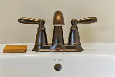 a bronze bathroom faucet on top of a sink at 261 LASSO DRIVE 6BED in Orlando