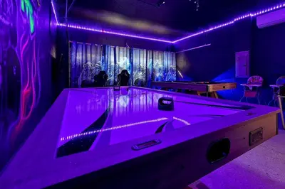 a room with a tub with purple lights on it at 261 LASSO DRIVE 6BED in Orlando