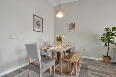 a dining room with a table and chairs at 2722 CLUB CORTILE UNIT B 3BED in Kissimmee