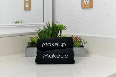 a black pillow sitting on a table with plants at 2722 CLUB CORTILE UNIT B 3BED in Kissimmee