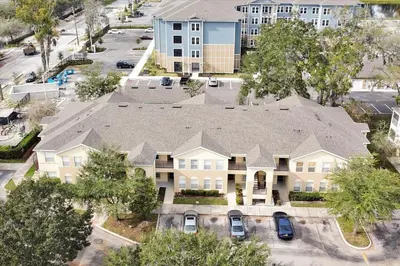 an overhead view of a house with a roof at 2722 CLUB CORTILE UNIT B 3BED in Kissimmee