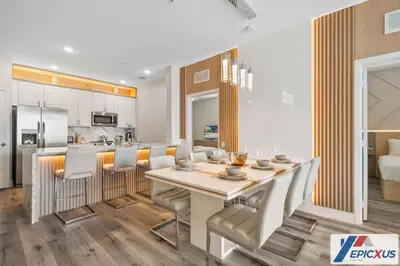 a kitchen and dining room with a table and chairs at The Epic Cork Vista Cay Orlando in Orlando