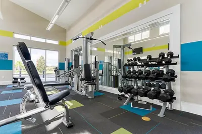 a gym with several treadmills and machines in a room at Veranda Palms Villa: Pool, Spa & Game Room in Kissimmee