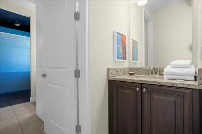 a bathroom with a sink and a mirror at Awsome 8 Bd 6.5 Ba Sleeps 20 Encore in Orlando