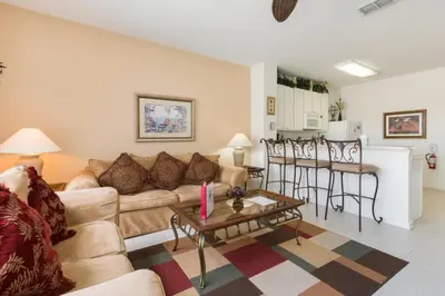 a living room with a couch and a table at Windsor Hills Getaway: 3BR, Pool, Near Disney in Orlando