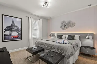 a bedroom with a large bed and a large window at 8 Bedroom 6.5 Bathroom Encore at Reunion 7644 in Orlando