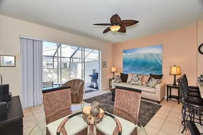 a living room with a ceiling fan and a couch at Windsor Palms Escape w/ Splash Pool in Kissimmee