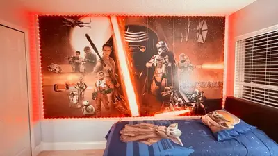 a bedroom with a star wars poster on the wall at Ultimate family resort home with incredible sunset views, 4 miles from Disney! in Kissimmee