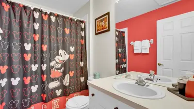 a bathroom with a sink and a shower curtain at SPD2326 in Kissimmee