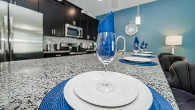 a wine glass sitting on top of a kitchen counter at JLT3076 Storey Lake Resort Vacation Townhome in Kissimmee