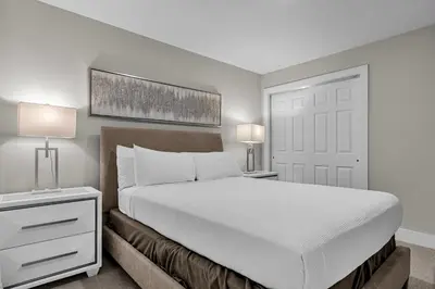 a bedroom with a white bed and two lamps at 3 Bedroom Family Friendly Condo at WorldQuest near Disney 2729 in Orlando