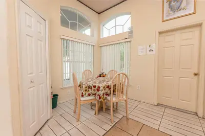 a dining room with a table and chairs at MVP 1511ABIB LONG TERM in Kissimmee