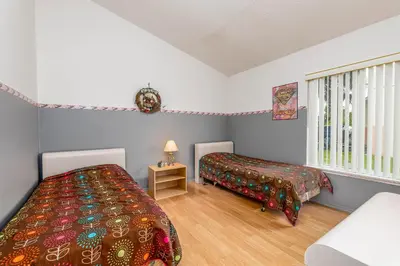 a bedroom with two beds and a window at MVP 1511ABIB LONG TERM in Kissimmee