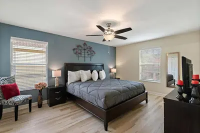 a bedroom with a bed and a ceiling fan at CUP8949 in Kissimmee