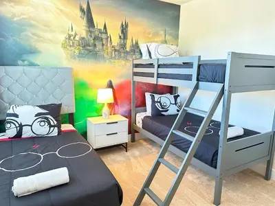 a bedroom with two bunk beds and a castle mural at TR1433SL - Island House Orlando in Orlando