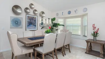 a dining room with a table and chairs at LDK2787 in Kissimmee