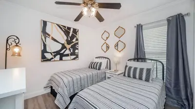 a bedroom with two beds and a ceiling fan at LDK2787 in Kissimmee
