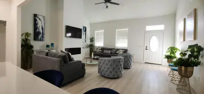 a living room with two couches and a table at Orlando Home Vacation near Universal Studios - 3 BR in Orlando