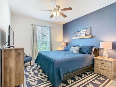 a bedroom with a bed and a ceiling fan at Windsor Hills Lovely 3BR Condo Slides Pool Disney in Orlando