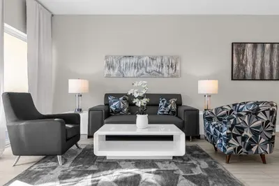 a living room with a couch and two chairs at 3 Bedroom Spacious Condo at WorldQuest near Disney- 22749 in Orlando