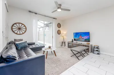 a living room with a couch and a tv at Amazing Townhouse TVPM in Kissimmee