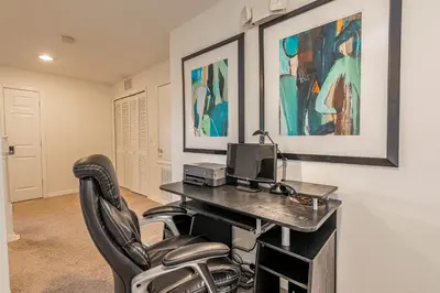 a home office with a desk and a chair at Gorgeous Villa with Pool and Spa in Kissimmee
