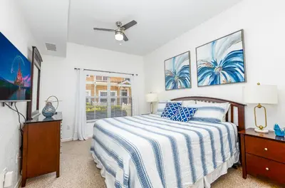 a bedroom with a bed and a ceiling fan at Spectacular townhouse with themed room in Kissimmee