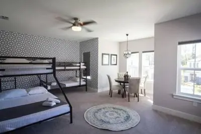 a bedroom with a bed and a dining room at Exclusive Orlando Getaway close to Disney in Kissimmee