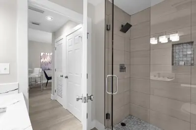 a bathroom with a shower and a glass door at 2 Bedroom Condo 6403 in Orlando