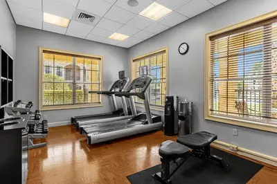 a gym with two treadmills and a treadmill at 2 Bedroom Condo 6403 in Orlando