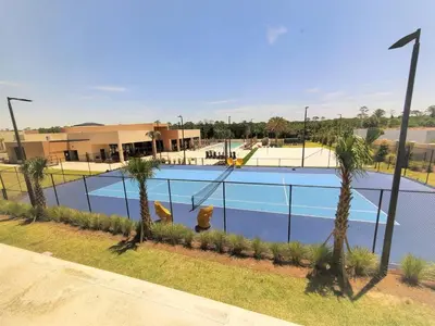 a swimming pool with a fire hydrant next to a fence at Magic Views Excelente 4 Suítes Perto da 192/Disney in Orlando