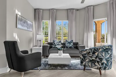 a living room with a couch and chairs and a table at Unit 5203 Worldquest in Orlando