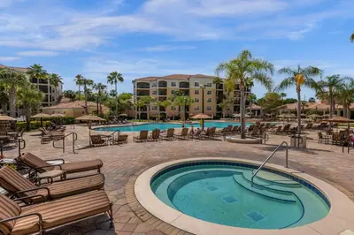 a swimming pool with lounge chairs and a resort at Unit 5203 Worldquest in Orlando