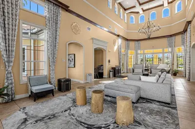 a large living room with a couch and chairs at Unit 5203 Worldquest in Orlando