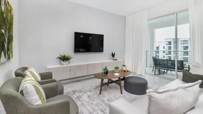 a living room with a tv on a white wall at PXC3180-303 in Kissimmee
