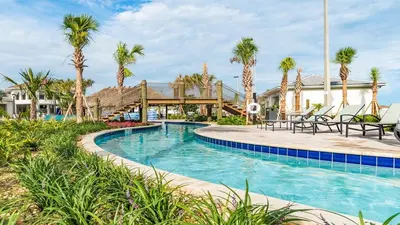 a pool at a resort with palm trees at PXC3151-102 in Kissimmee