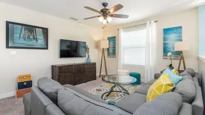 a living room with two couches and a tv at KCC 4797 in Kissimmee