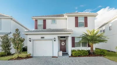 a white house with a garage at KCC4749 in Kissimmee