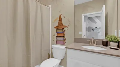 a bathroom with a toilet and a sink and a shower at PLW4277 in Kissimmee