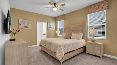 a bedroom with a bed and a ceiling fan at PGD4169 in Kissimmee